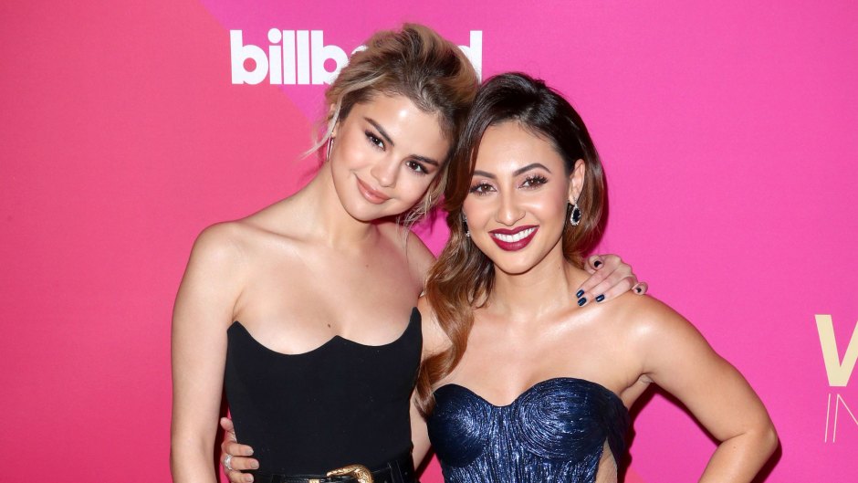 Selena Gomez wearing a black leather outfit and Francia Raisa wearing a blue dress at Billboard's Women in Music event