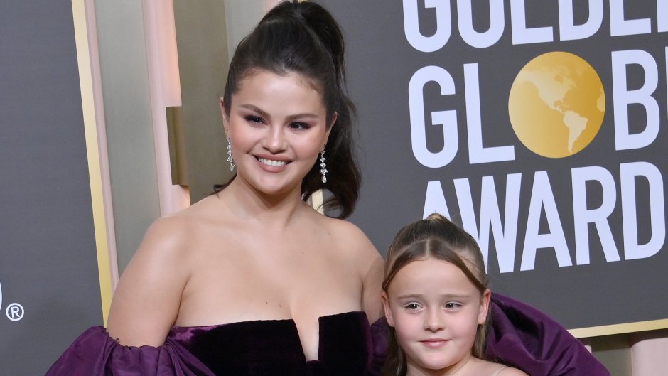 Selena Gomez wearing a black dress and purple shawl and her younger half-sister Gracie