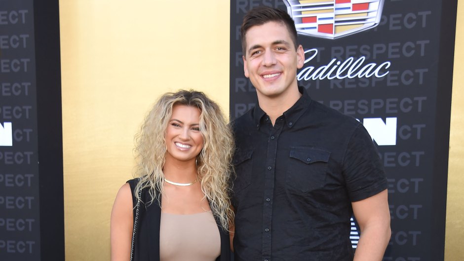 Tori Kelly poses with her husband Andre Murillo in coordinating black outfits at an event