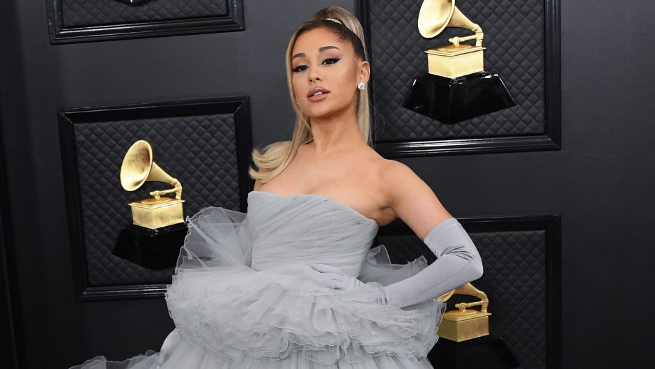 Ariana Grande wearing a gray tulle gown on the red carpet of the Grammy Awards