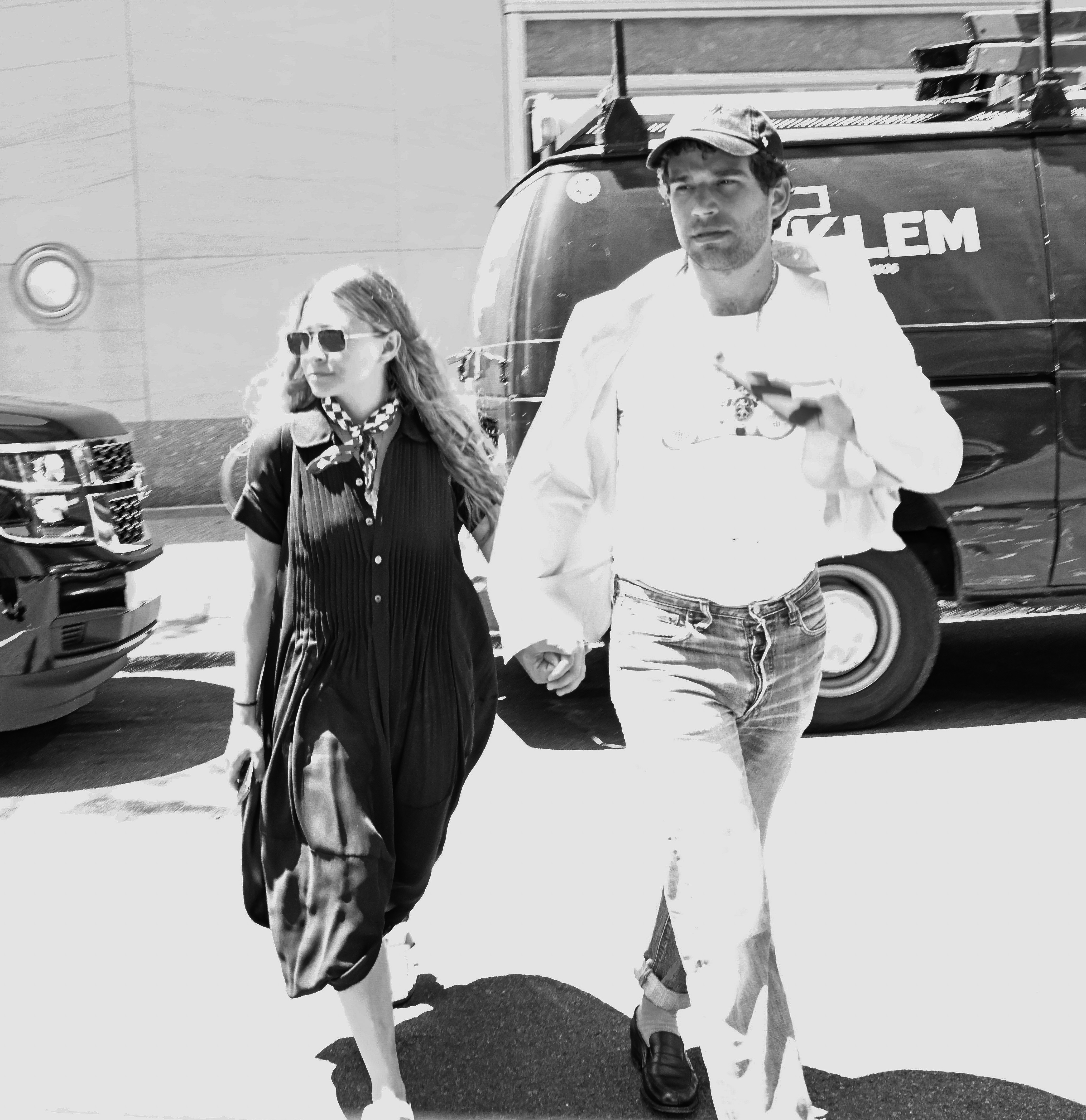 Ashley Olsen and Louis Eisner hold hands on the streets of New York