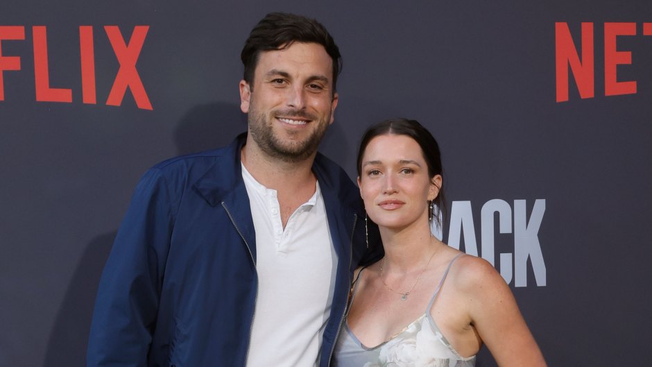 Tanner Tolbert and Jade Roper posing at a Netflix premiere