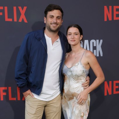 Tanner Tolbert and Jade Roper posing at a Netflix premiere