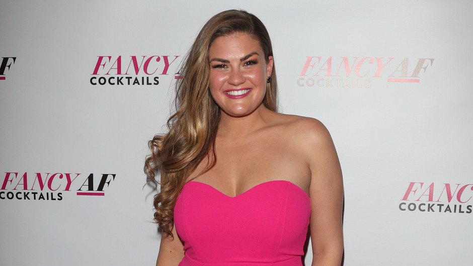 Brittany Cartwright wearing a pink strapless jumpsuit on the red carpet