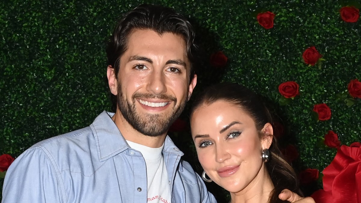 Jason Tartick wraps his arm around fiancee Kaitlyn Bristowe at a Bachelor Nation event
