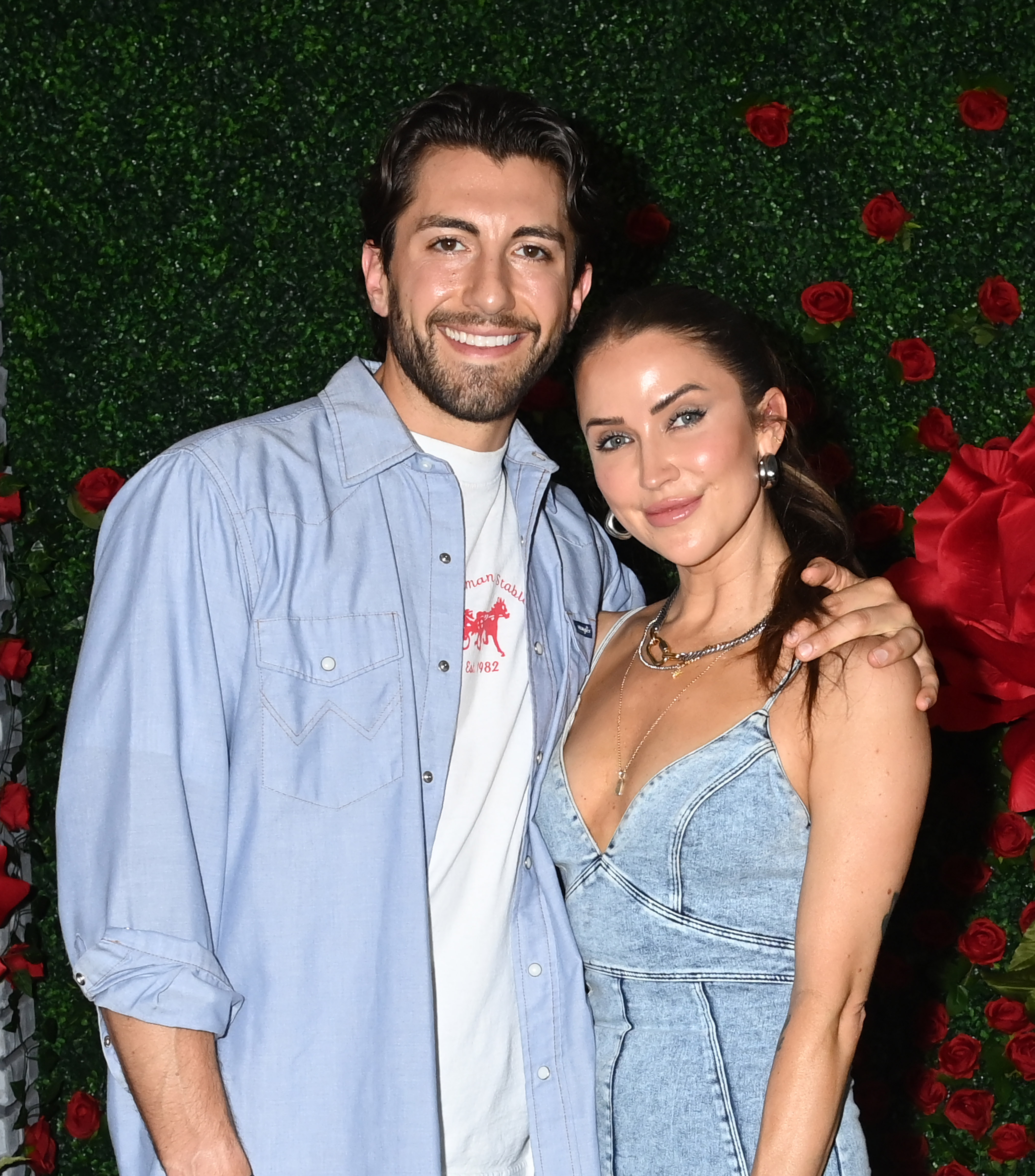 Jason Tartick wraps his arm around fiancee Kaitlyn Bristowe at a Bachelor Nation event