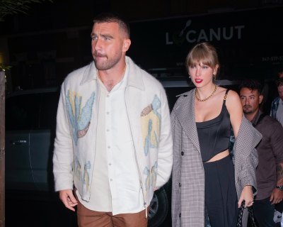 Travis Kelce holds Taylor Swift's hand during a night out.