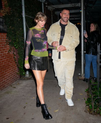 Taylor Swift and Travis Kelce holding hands as they leave Waverly Inn.