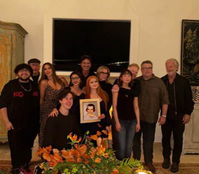 Modern Family cast poses with Ty Burrell photo at reunion