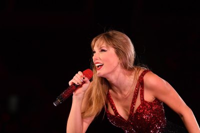 Taylor Swift performing the first night of her Eras tour in Argentina. Travis Kelce skipped the concert in favor of attending Patrick Mahomes' charity gala.