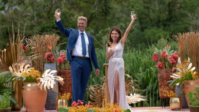 Gerry Turner and Theresa Nist raise their arms in celebration after getting engaged.
