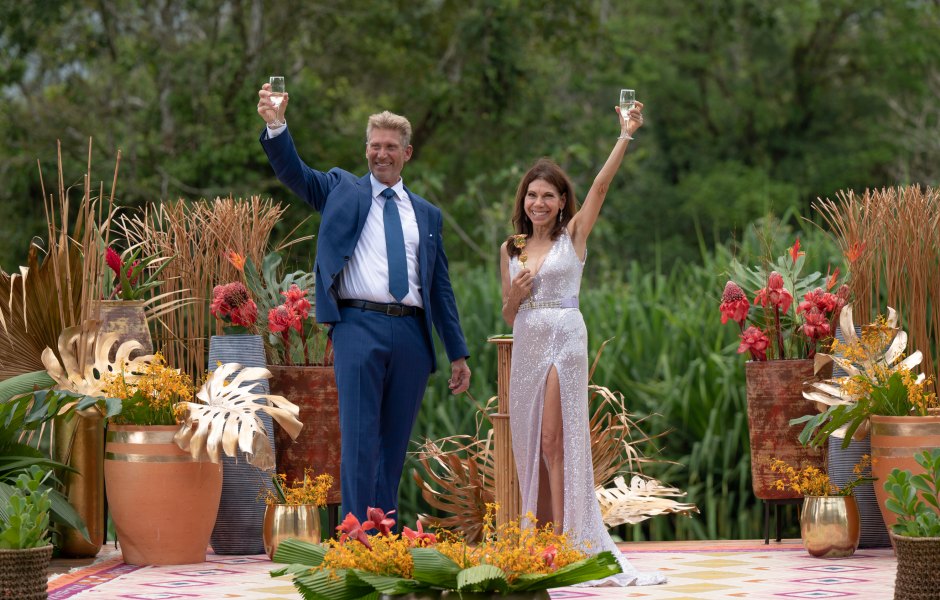 Gerry Turner and Theresa Nist raise their arms in celebration after getting engaged.