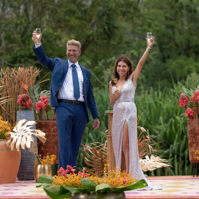 Gerry Turner and Theresa Nist raise their arms in celebration after getting engaged.