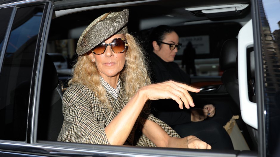 Celine Dion sits in the back seat of a car with the window rolled down