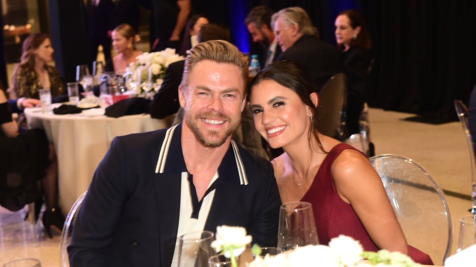 Derek Hough and wife Hayley Erbert sit at a table at the NAMI West Los Angeles first annual 2023 Mental Health Gala