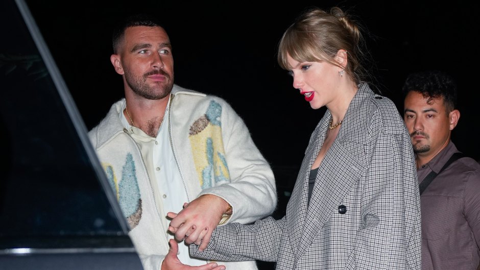 Travis Kelce holds Taylor Swift's hand as he lets her into a silver car.
