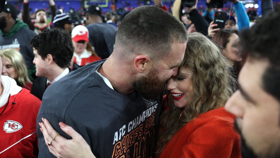 taylor swift kisses travis kelce on field after playoff win