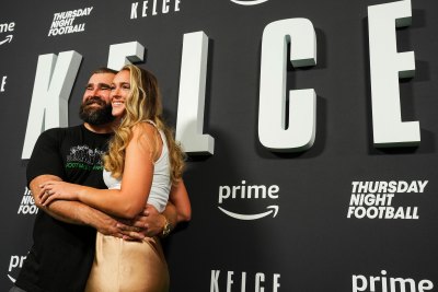 Jason Kelce and Kylie Kelce pose for a photo at the Kelce documentary premiere.