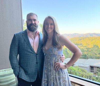 Kylie Kelce and Jason Kelce post for a photo at a friend's wedding.