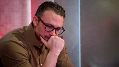 A scene from 'Love Is Blind' season 6 showing Matthew Duliba wearing glasses and a brown button down.