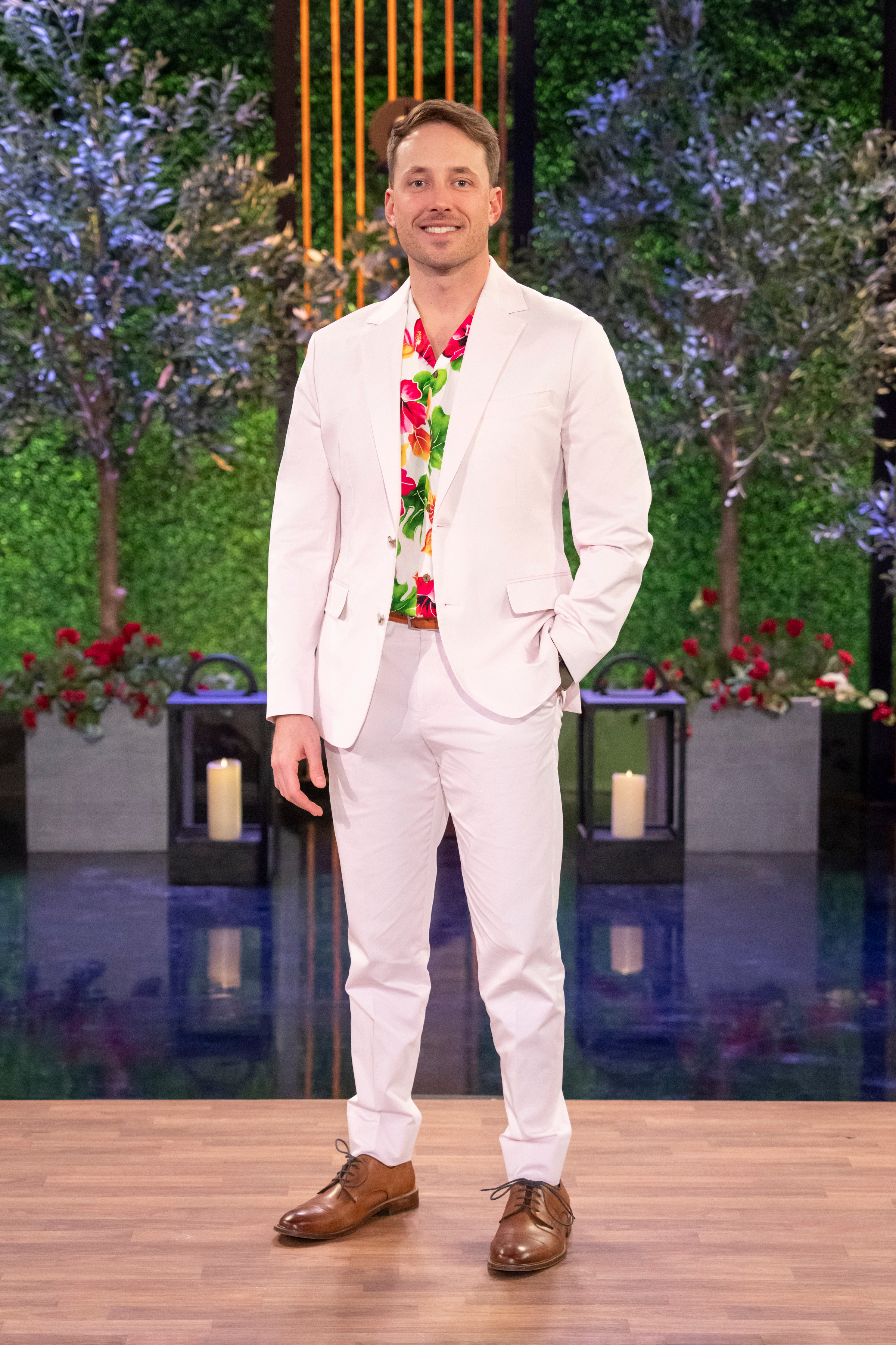 Love Is Blind's Jeramey Lutinski wearing a white suit and a brightly colored Hawiian shirt at the reunion