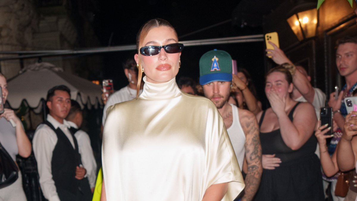 Hailey Bieber Cradles Baby Bump in Satin Dress on Date Night With Justin Bieber: Photos