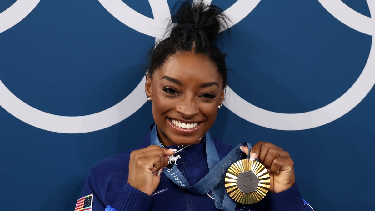 Simone Biles Claps Back at Haters With GOAT Necklace
