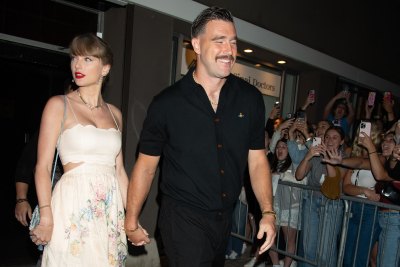 taylor swift travis kelce hold hands leaving wedding in nyc
