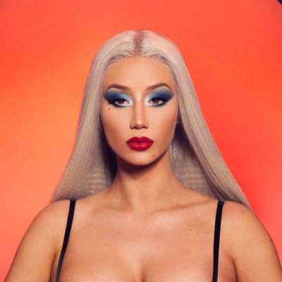 Iggy Azalea looking at the camera with a no-nonsense expression, showing off the confidence that comes with Unreal’s no-contract mobile plans. Photo source: Viberate