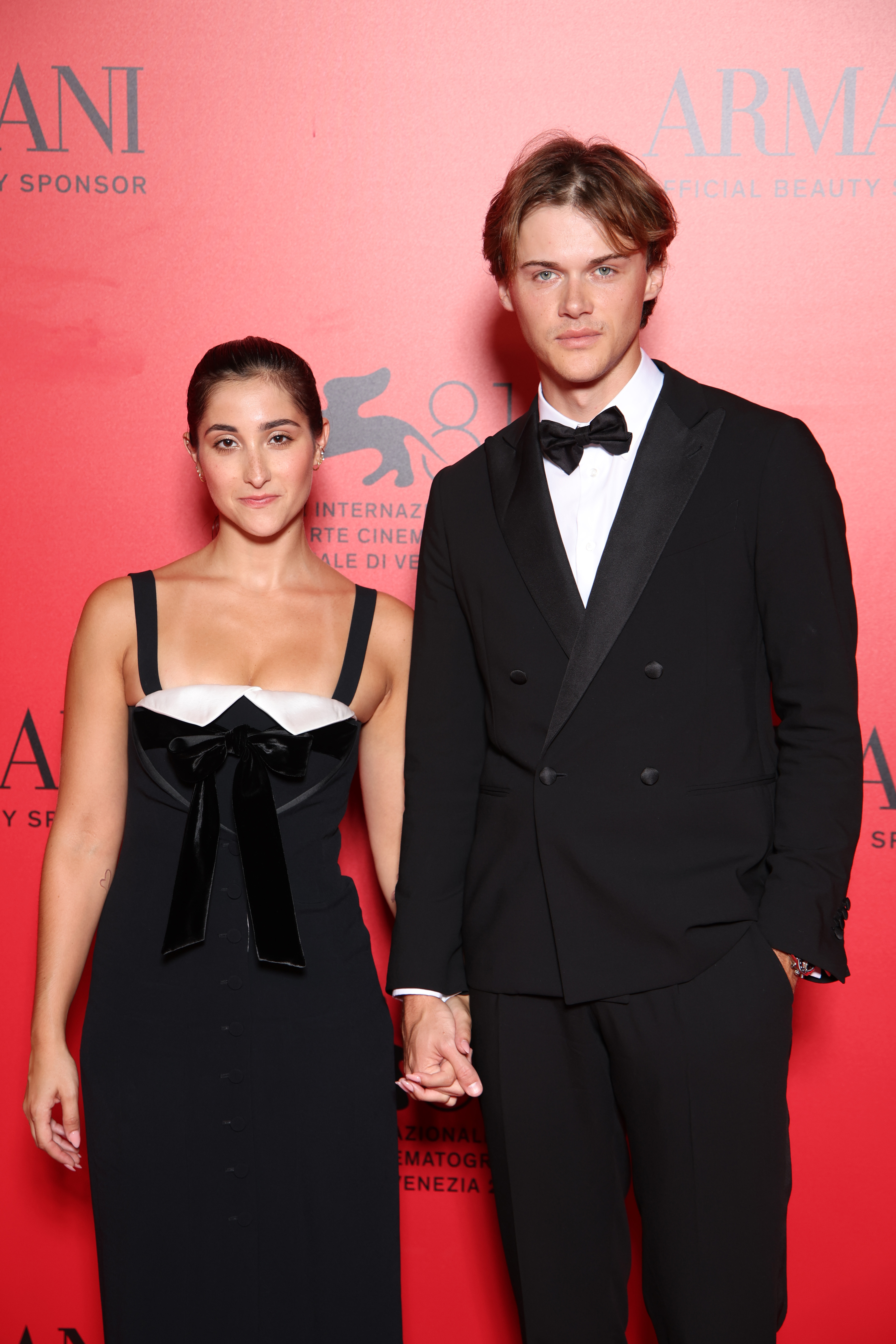 VENICE, ITALY - AUGUST 31: Isabel Machado and Christopher Briney attend the Armani Beauty Passione Party during the 81st Venice International Film Festival at Arsenale on August 31, 2024 in Venice, Italy. (Photo by Daniele Venturelli/Getty Images for Armani Beauty)
