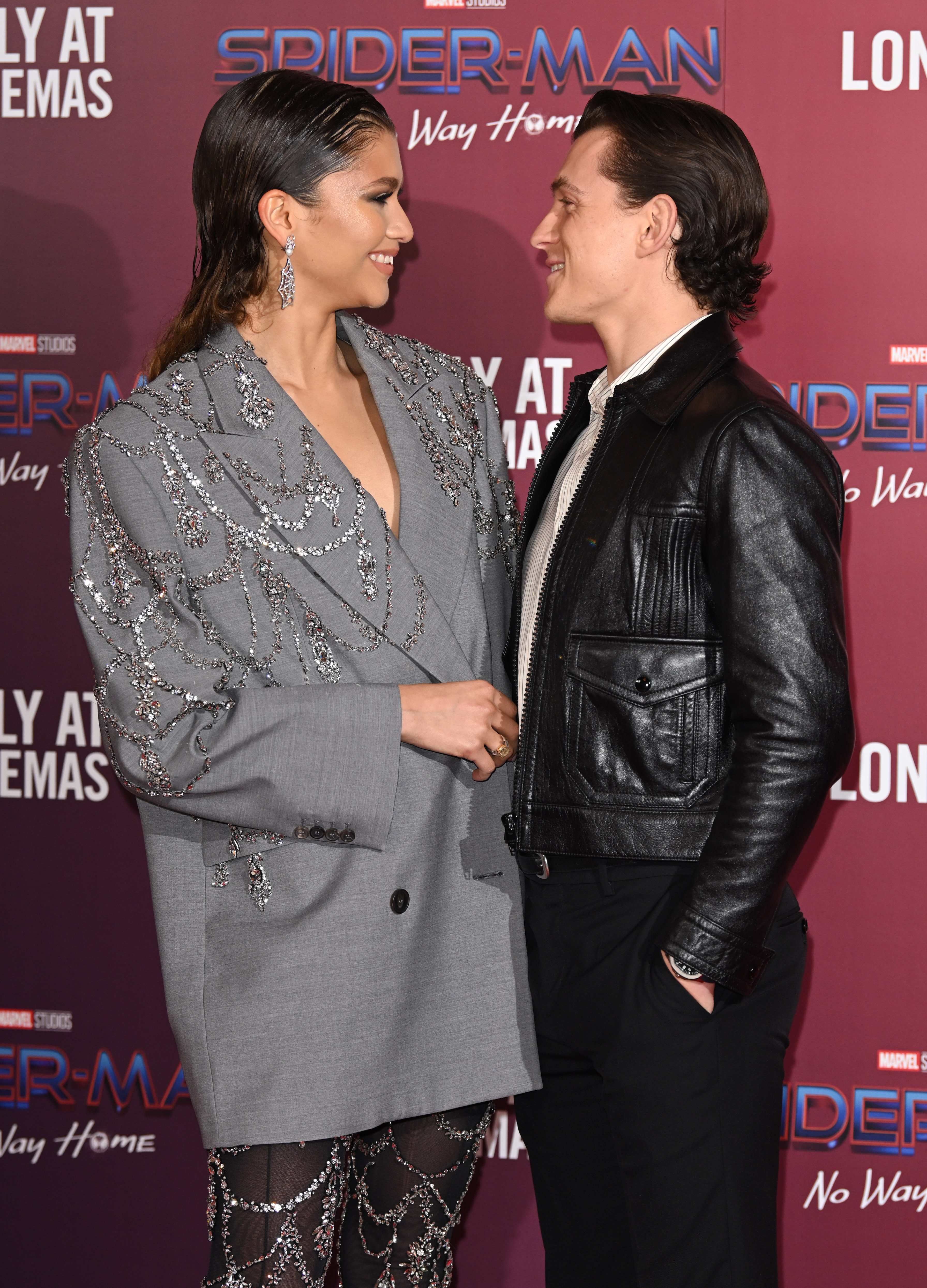 LONDON, ENGLAND - DECEMBER 05: Zendaya and Tom Holland attend a photocall for "Spiderman: No Way Home" at The Old Sessions House on December 05, 2021 in London, England. (Photo by Karwai Tang/WireImage)