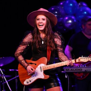 1385876936 NASHVILLE, TENNESSEE - MARCH 16: Maggie Baugh performs on stage during 'Maggie Baugh & Friends' at 3rd & Lindsley on March 16, 2022 in Nashville, Tennessee. (Photo by Terry Wyatt/Getty Images)