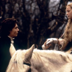 607434110 American actors Johnny Depp and Christina Ricci on the set of Sleepy Hollow, based on the story by Washington Irving and directed by Tim Burton. (Photo by Paramount Pictures/Corbis via Getty Images)