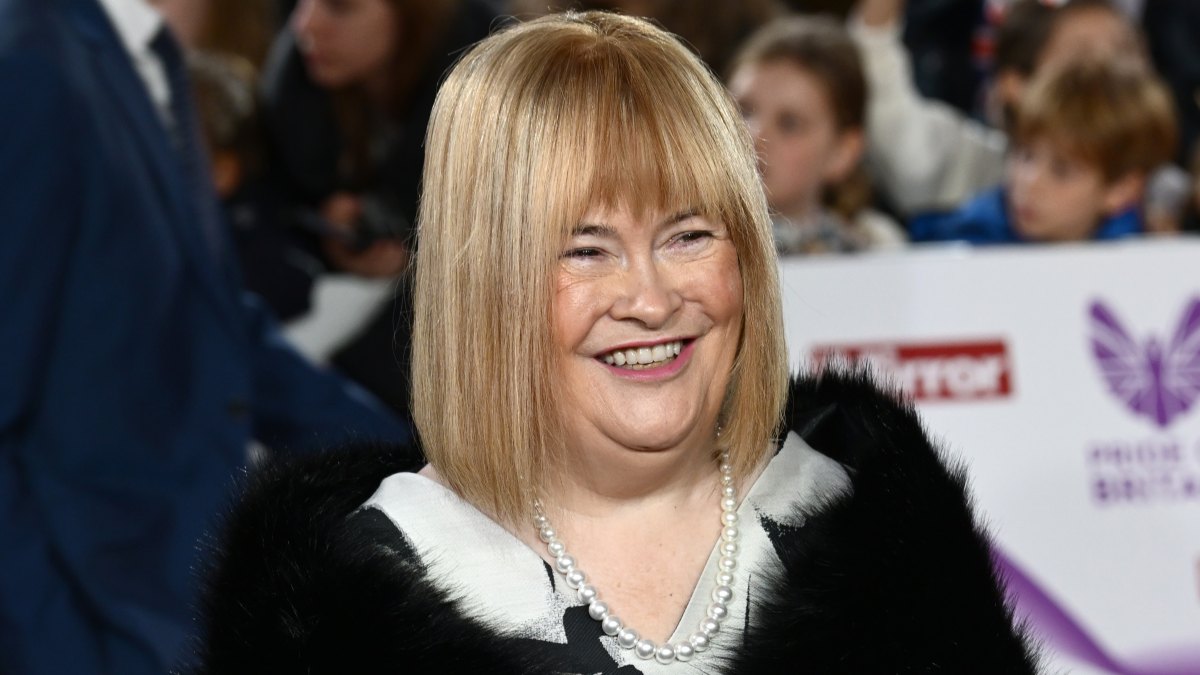 2242209209 Susan Boyle Debuts Dramatic Red Carpet Makeover at British Awards Show