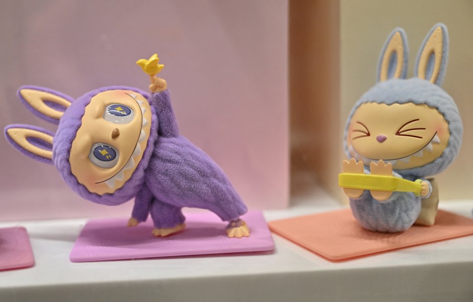 This photograph shows a view of Labubu elves, collectible plush toys designed by Hong Kong illustrator Kasing Lung as part of his series "The Monsters", displayed at a Pop Mart shop in Paris on August 17, 2025. (Photo by Martin LELIEVRE / AFP) / RESTRICTED TO EDITORIAL USE - MANDATORY MENTION OF THE ARTIST UPON PUBLICATION - TO ILLUSTRATE THE EVENT AS SPECIFIED IN THE CAPTION (Photo by MARTIN LELIEVRE/AFP via Getty Images)