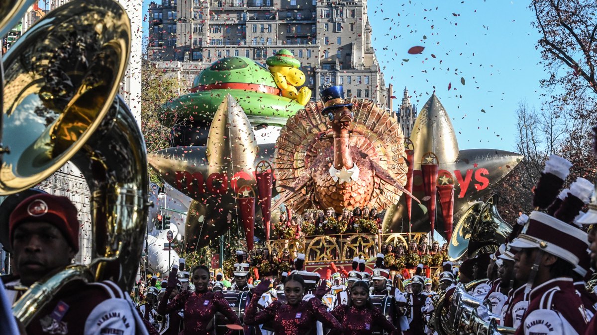 1798518715 NEW YORK, NEW YORK - NOVEMBER 23: People participate in Macy's annual Thanksgiving Day Parade on November 23, 2023 in New York City. Thousands of people lined the streets to watch the 25 balloons and hundreds of performers march in this parade happening since 1924. (Photo by Stephanie Keith/Getty Images)