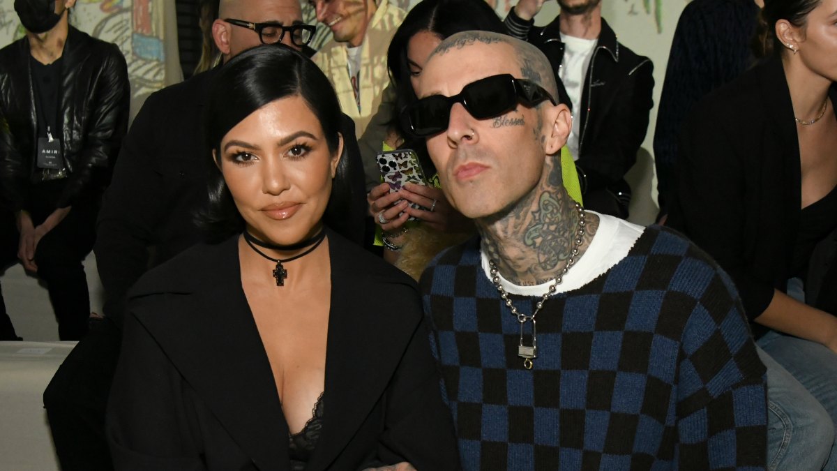 1369479637 LOS ANGELES, CALIFORNIA - FEBRUARY 08: (L-R) Kourtney Kardashian and Travis Barker attend the AMIRI Autumn-Winter 2022 Runway Show on February 08, 2022 in Los Angeles, California. (Photo by Rodin Eckenroth/Getty Images)