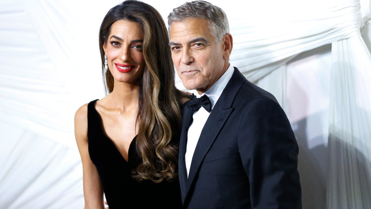 2173810297TOPSHOT - US actor George Clooney (R) and his wife Lebanese-British barrister Amal Clooney arrive for "The Albies" hosted by the Clooney Foundation for Justice at the New York Public Library in New York, September 26, 2024. The Albies is the Clooney Foundation for Justice's annual event honoring courageous defenders of justice. The event is named in honor of Justice Albie Sachs, who is revered for his heroic commitment to ending apartheid. (Photo by John Lamparski / AFP) (Photo by JOHN LAMPARSKI/AFP via Getty Images)