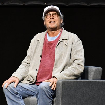 1192233828 LOS ANGELES, CALIFORNIA - DECEMBER 05: Chevy Chase speaks during a Q&A session following a special screening of "National Lampoon's Christmas Vacation" at Microsoft Theater on December 05, 2019 in Los Angeles, California. (Photo by Allen Berezovsky/Getty Images)