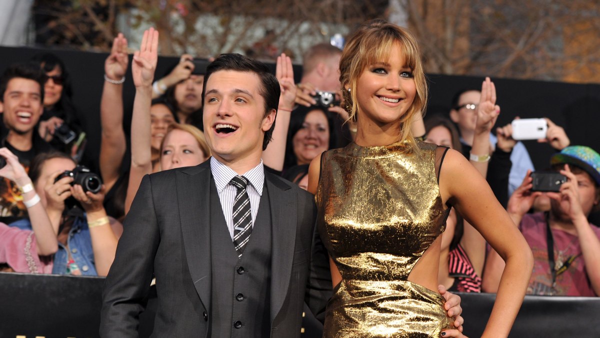 141201537. LOS ANGELES, CA - MARCH 12: Actors Josh Hutcherson (L) and Jennifer Lawrence arrive at the premiere of Lionsgate's "The Hunger Games" at Nokia Theatre L.A. Live on March 12, 2012 in Los Angeles, California. (Photo by Kevin Winter/Getty Images)