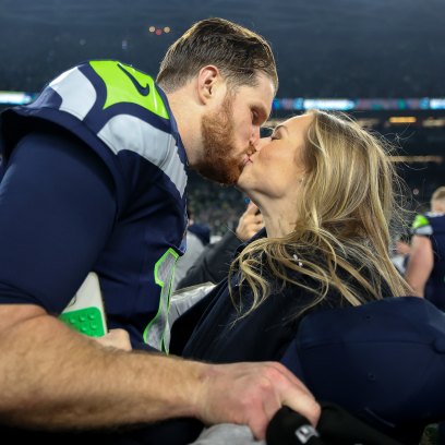 SEATTLE, WASHINGTON - JANUARY 25: Sam Darnold #14 of the Seattle Seahawks kisses his fiance Katie Hoofnagle after defeating the 31-27 in the NFC Championship game at Lumen Field on January 25, 2026 in Seattle, Washington. The Seahawks won 31-27. (Photo by Steph Chambers/Getty Images)