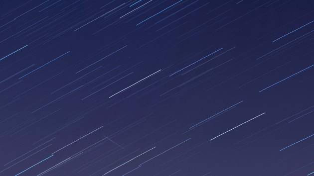 LONDON, ENGLAND - APRIL 21: (EDITORS NOTE: Multiple exposures were combined in camera to produce this image.) A meteor crosses the sky illuminated under the stars on a clear night on April 21, 2020 in London, England. The clear skies created by the New Moon coincide with the Lyrid meteor shower, an annual display caused by the Earth passing through a cloud of debris from a comet called C/186 Thatcher. (Photo by Simon Robling/Getty Images)