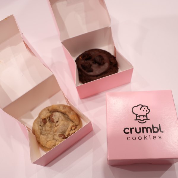 NEW YORK, NEW YORK - OCTOBER 13: A view of Crumbl Cookies during Food Network New York City Wine & Food Festival presented by Capital One - Blue Moon Burger Bash presented by Pat LaFrieda Meats hosted by Rachael Ray at Pier 86 on October 13, 2023 in New York City. (Photo by Monica Schipper/Getty Images for NYCWFF)