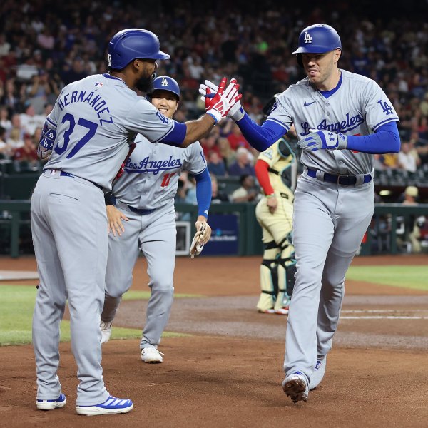 PHOENIX, ARIZONA - AUGUST 30: Freddie Freeman #5 of the Los Angeles Dodgers high fives Teoscar Hernández #37 and Shohei Ohtani #17 after hitting a two-run home run against the Arizona Diamondbacks during the first inning of the MLB game at Chase Field on August 30, 2024 in Phoenix, Arizona. (Photo by Christian Petersen/Getty Images)