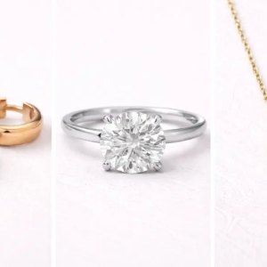 Gold hoop earrings, a diamond solitaire ring, and a heart-shaped diamond pendant necklace displayed on a neutral background