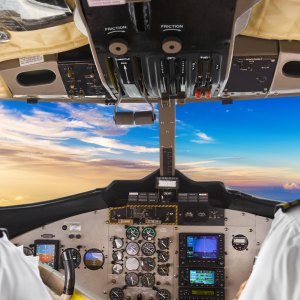 JFFX76 Pilots in the plane cockpit and sunset. Image shot 03/2017. Exact date unknown.