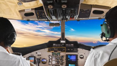 JFFX76 Pilots in the plane cockpit and sunset. Image shot 03/2017. Exact date unknown.