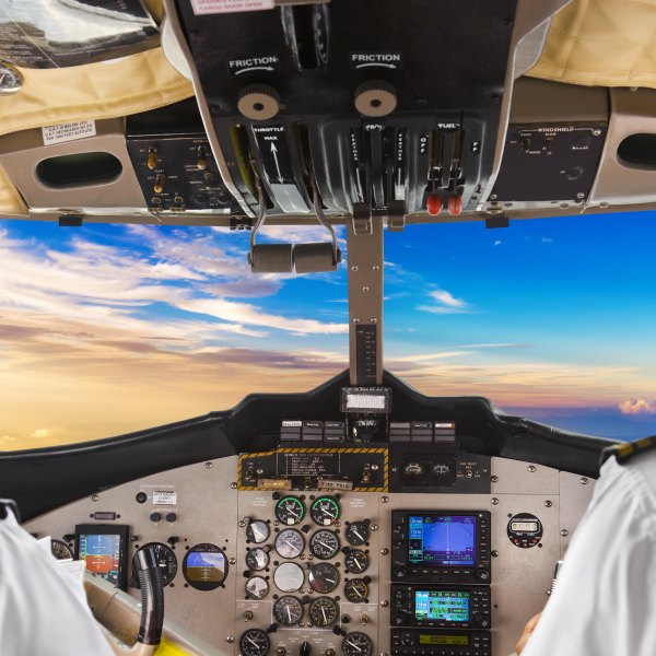 JFFX76 Pilots in the plane cockpit and sunset. Image shot 03/2017. Exact date unknown.