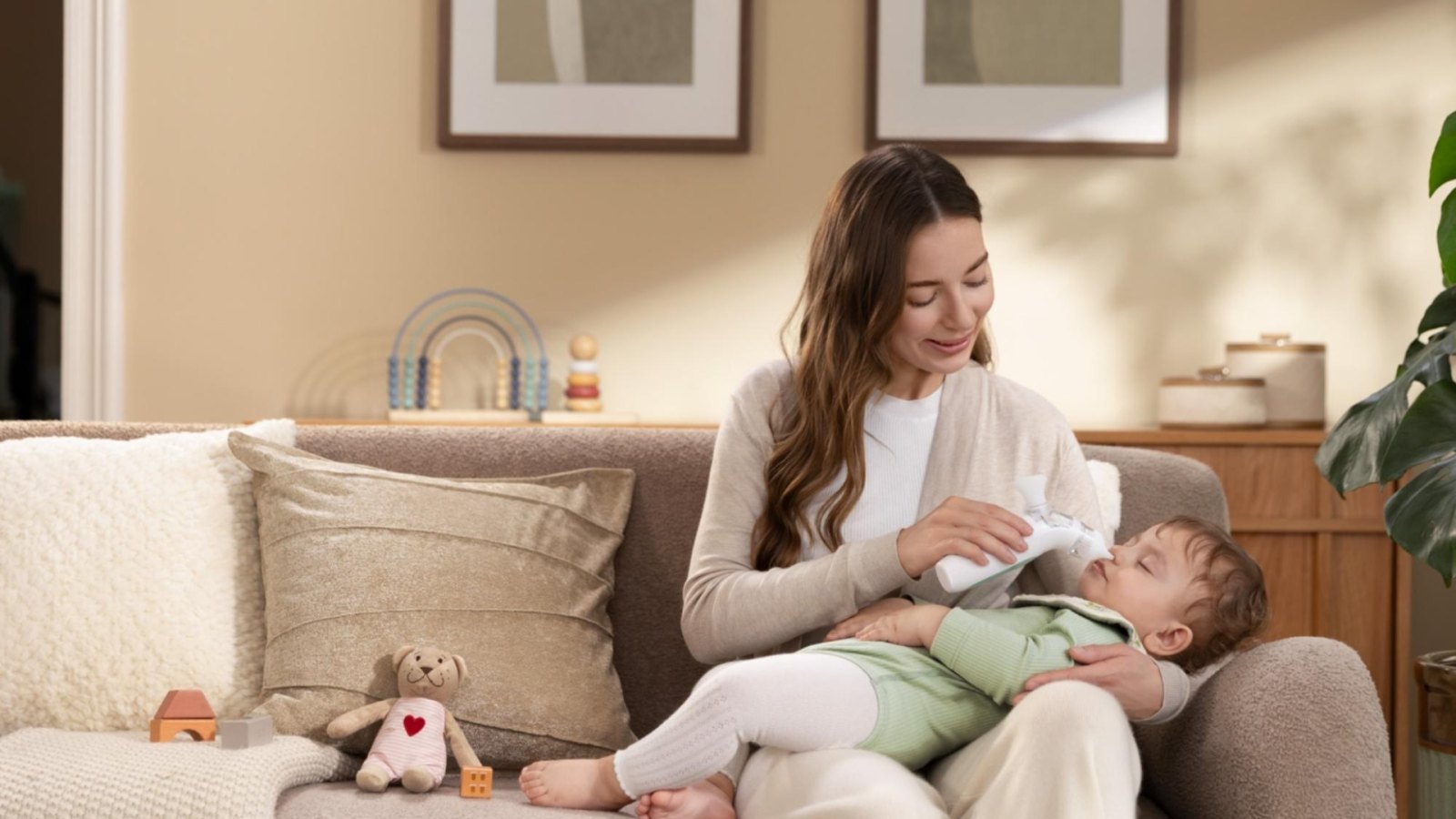 Parent using Momcozy baby care essentials with an infant during a daily care routine.