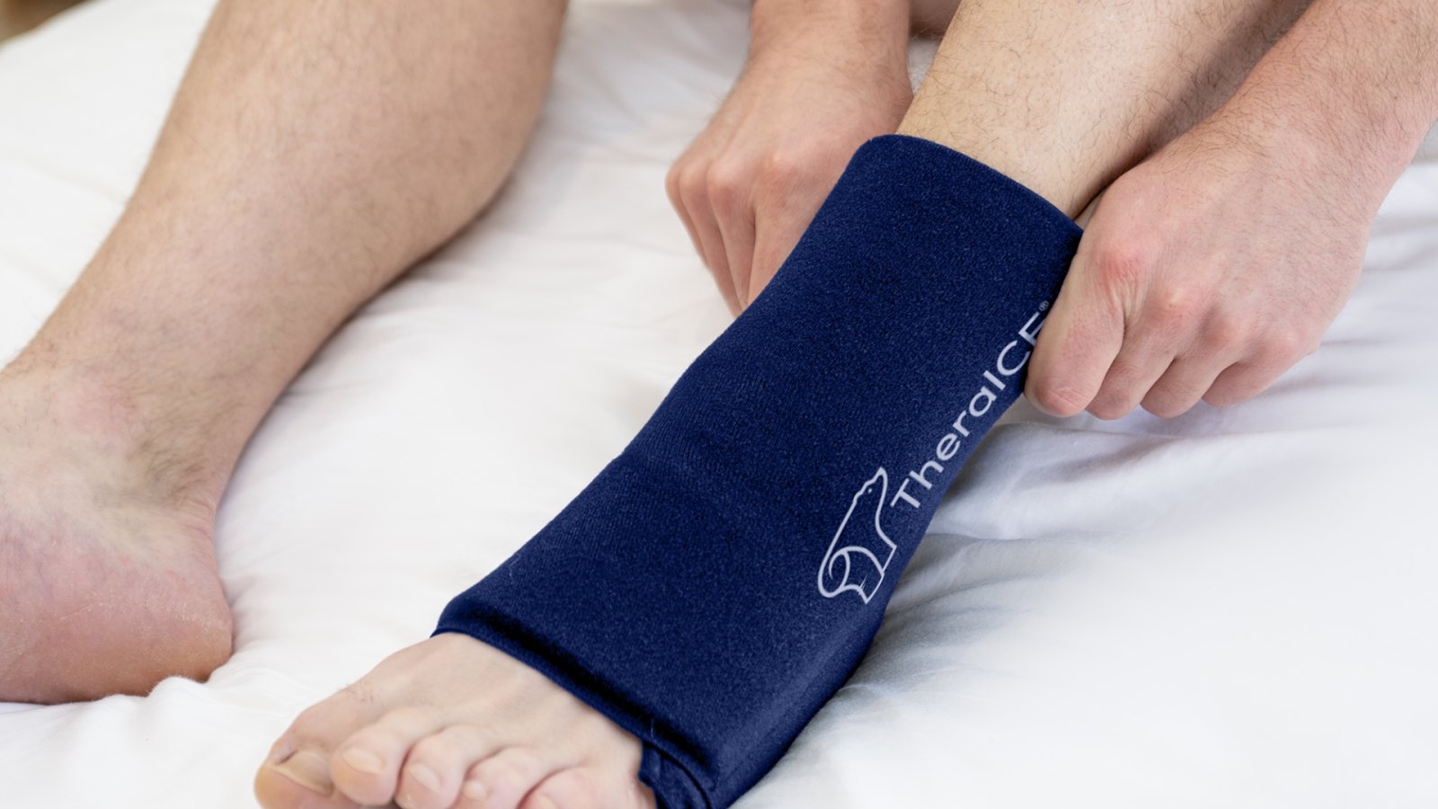Person wearing the AnySLEEVE compression wrap during recovery.